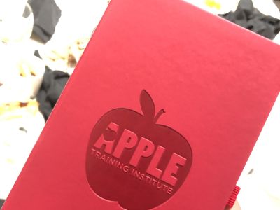 red book with Apple logo on the cover